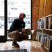 Ann Arbor resident Justin Gold browses the selection in the picture book section at Literati Bookstore on Monday, April 1. Gold saw someone walking on the street with a Literati bag and decided to shop. Daniel Brenner I AnnArbor.com